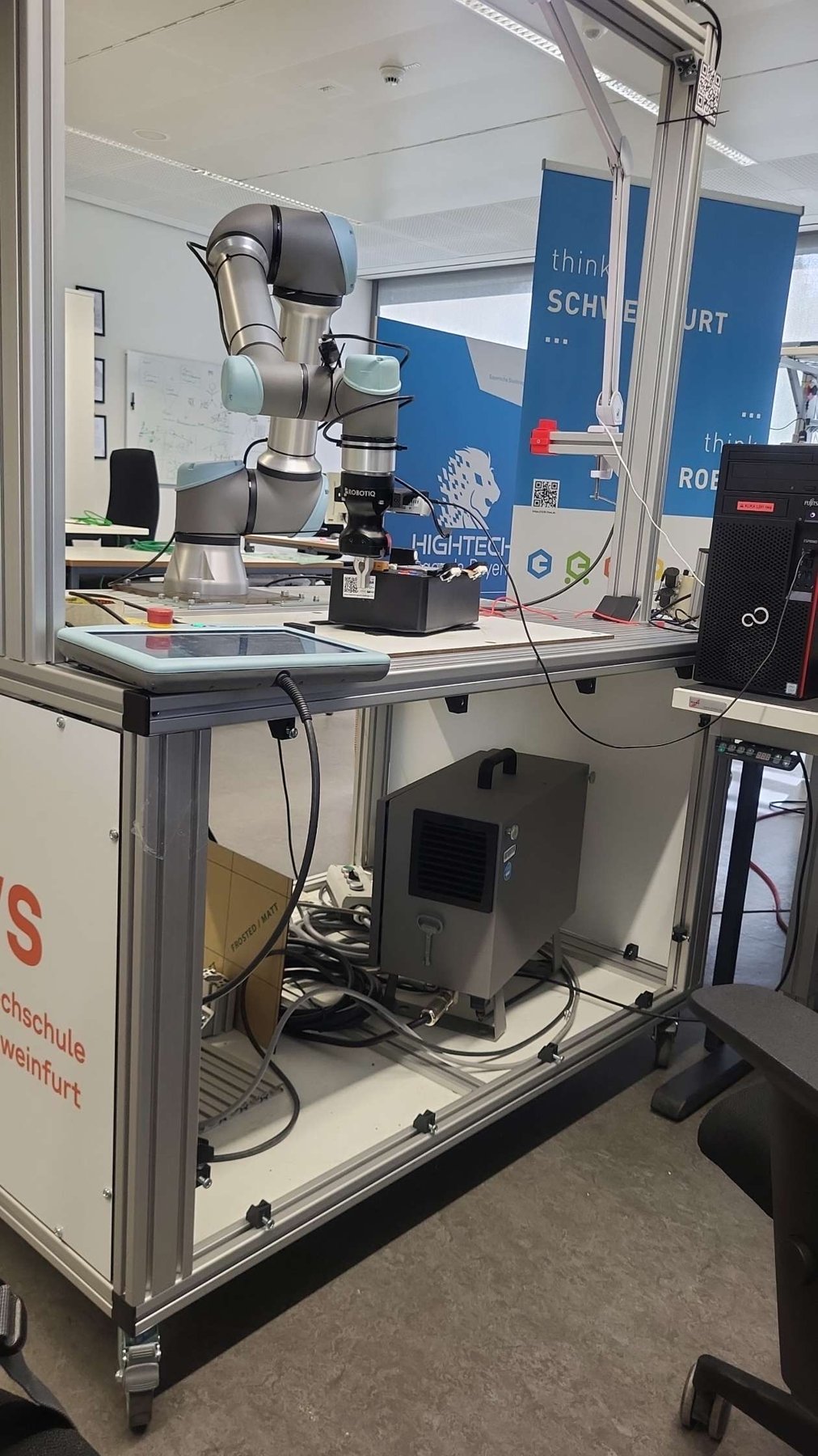 Robotic arm workcell in a university robotics lab